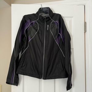Sugoi Womens running jacket with removable sleeves. Excellent condition.